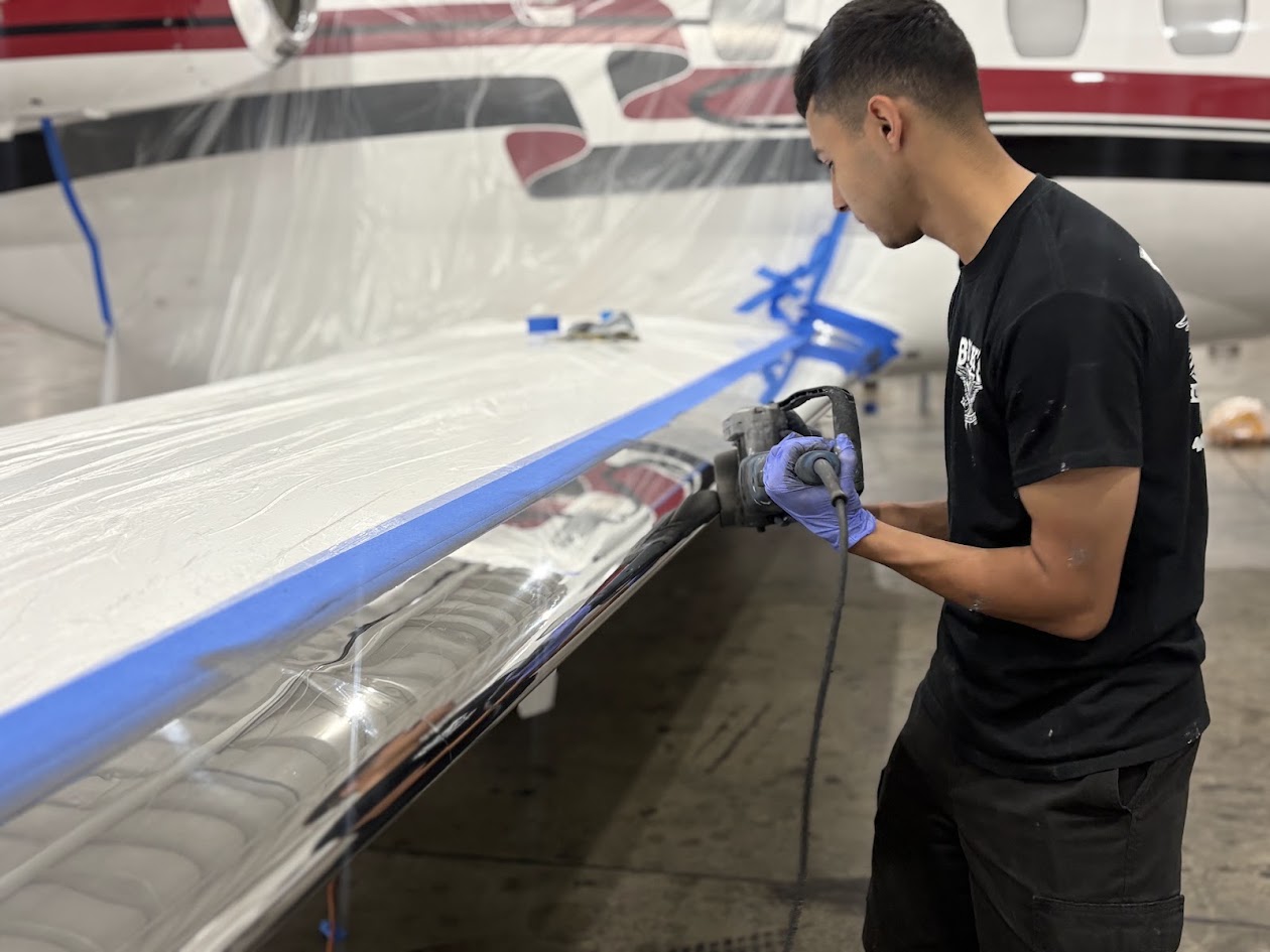 Aero Spec team member completing brightwork metal polishing